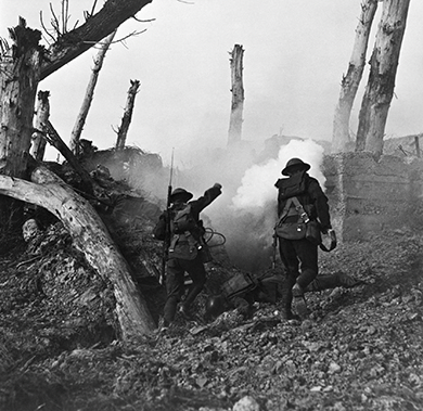 Figure 23.15 U.S. soldiers run past fallen Germans on their way to a bunker. In World War I, for the first time, photographs of the battles brought the war vividly to life for those at home.
