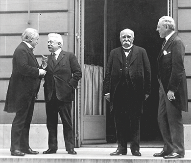 Figure 23.18 The Paris Peace Conference held the largest number of world leaders in one place to date. The photograph shows (from left to right) Prime Minister David Lloyd George of Great Britain; Vittorio Emanuele Orlando, prime minister of Italy; Georges Clemenceau, prime minister of France; and President Woodrow Wilson discussing the terms of the peace.