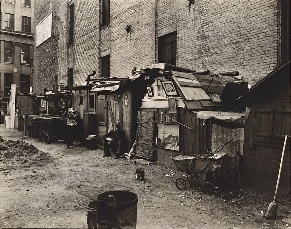 Figure 25.1 In 1935, American photographer Berenice Abbott photographed these shanties, which the unemployed in Lower Manhattan built during the depths of the Great Depression. (credit: modification of work by Works Progress Administration)