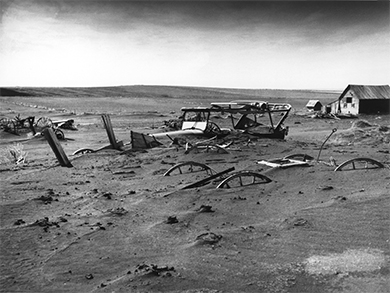 Figure 25.14 As the Dust Bowl continued in the Great Plains, many had to abandon their land and equipment, as captured in this image from 1936, taken in Dallas, South Dakota. (credit: United States Department of Agriculture)