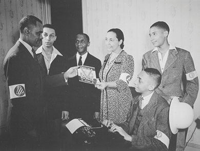 Figure 27.13 During World War II, African Americans volunteered for government work just as white Americans did. These Washington, DC, residents have become civil defense workers as part of the Double V campaign that called for victory at home and abroad.