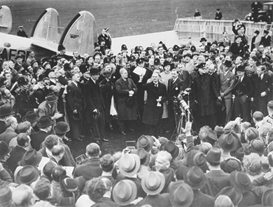 Figure 27.4 Prime Minister Neville Chamberlain arrives home in England bearing the Munich Pact agreement. The jubilant Chamberlain proclaimed that the agreement meant “peace in our time.”