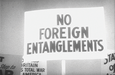 Figure 27.5 This protest sign shows the unwillingness of many Americans to become involved in a foreign war. A reluctance to intervene in events outside of the Western Hemisphere had characterized American foreign policy since the administration of George Washington. World War I had been an exception that many American politicians regretted making.