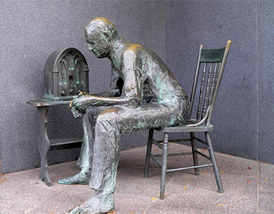Figure 26.5 Roosevelt’s “fireside chats” provided an opportunity for him to speak directly to the American people, and the people were happy to listen. These radio addresses, commemorated at the Franklin D. Roosevelt Memorial in Washington, DC, with this bronze sculpture by George Segal, contributed to Roosevelt’s tremendous popularity. (credit: Koshy Koshy)
