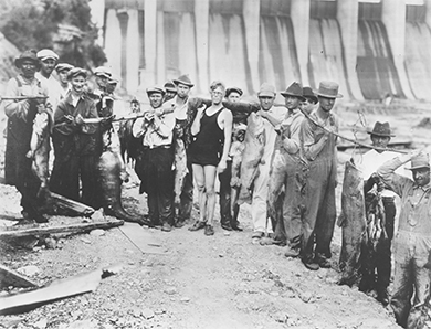 Figure 26.9 The TVA helped a struggling part of the country through the creation of jobs, and flood control and reforestation programs. The Wilson Dam, shown here, is one of nine TVA dams on the Tennessee River. (credit: United States Geological Survey)