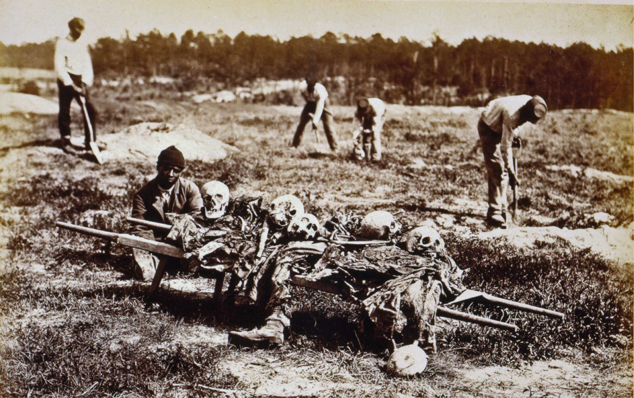 Figure 15.1 This photograph by John Reekie, entitled, “A burial party on the battle-field of Cold Harbor,” drives home the brutality and devastation wrought by the Civil War. Here, in April 1865, African Americans collect the bones of soldiers killed in Virginia during General Ulysses S. Grant’s Wilderness Campaign of May–June 1864.