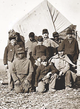 Figure 15.17 African American and white soldiers of the Union army pose together in this photograph, although in reality, black soldiers were often kept separate and given only menial jobs.
